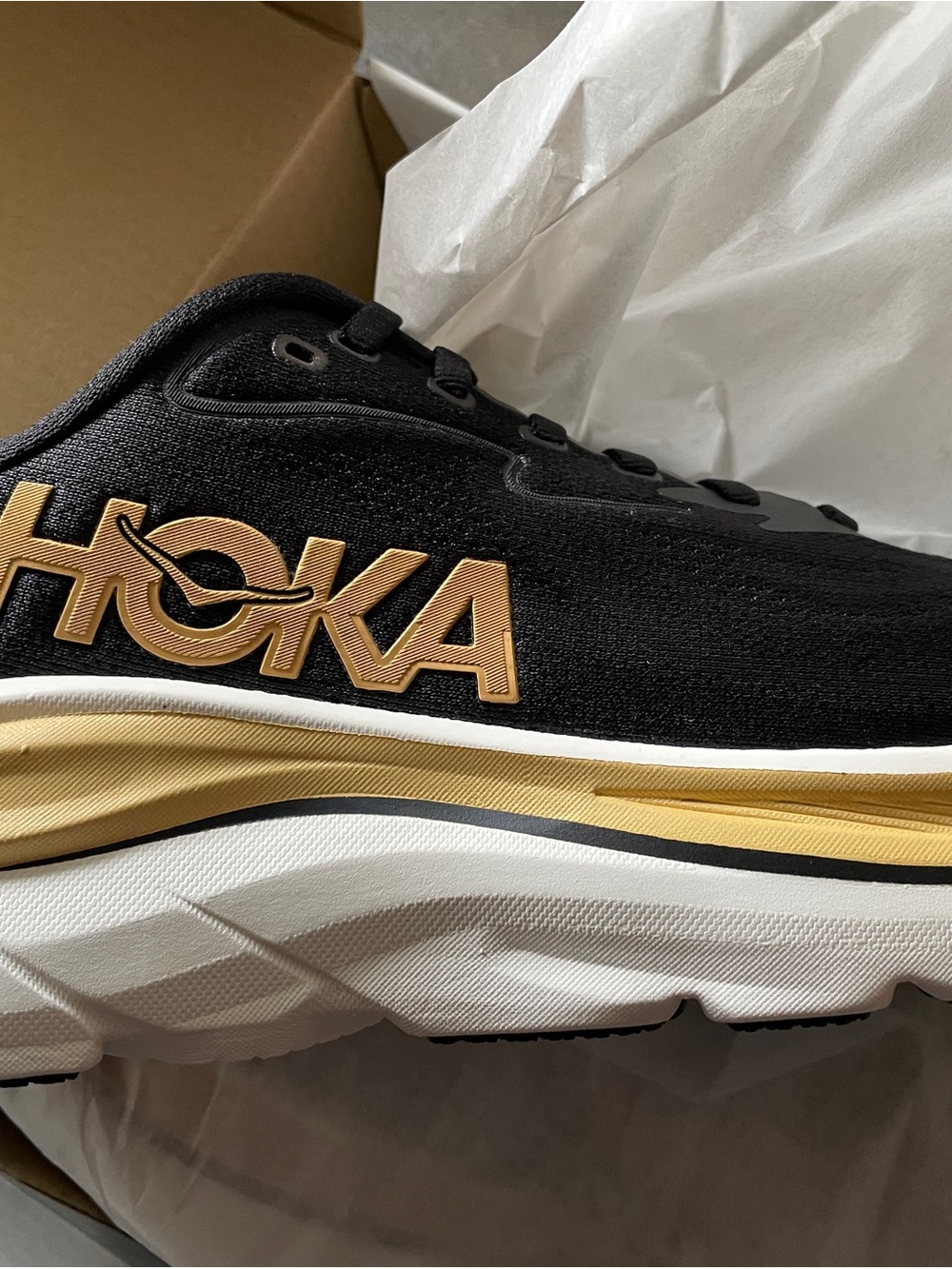 Hoka Women’s Black and Gold Athletic Trainer